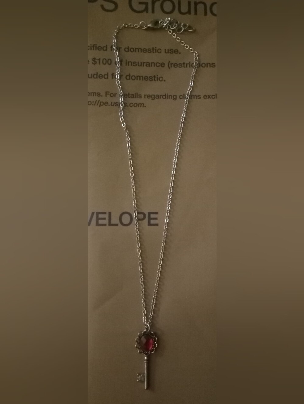 Vintage Silver Tone Red Crystal Faceted Ornate Bow Skeleton Key Pendant Necklace